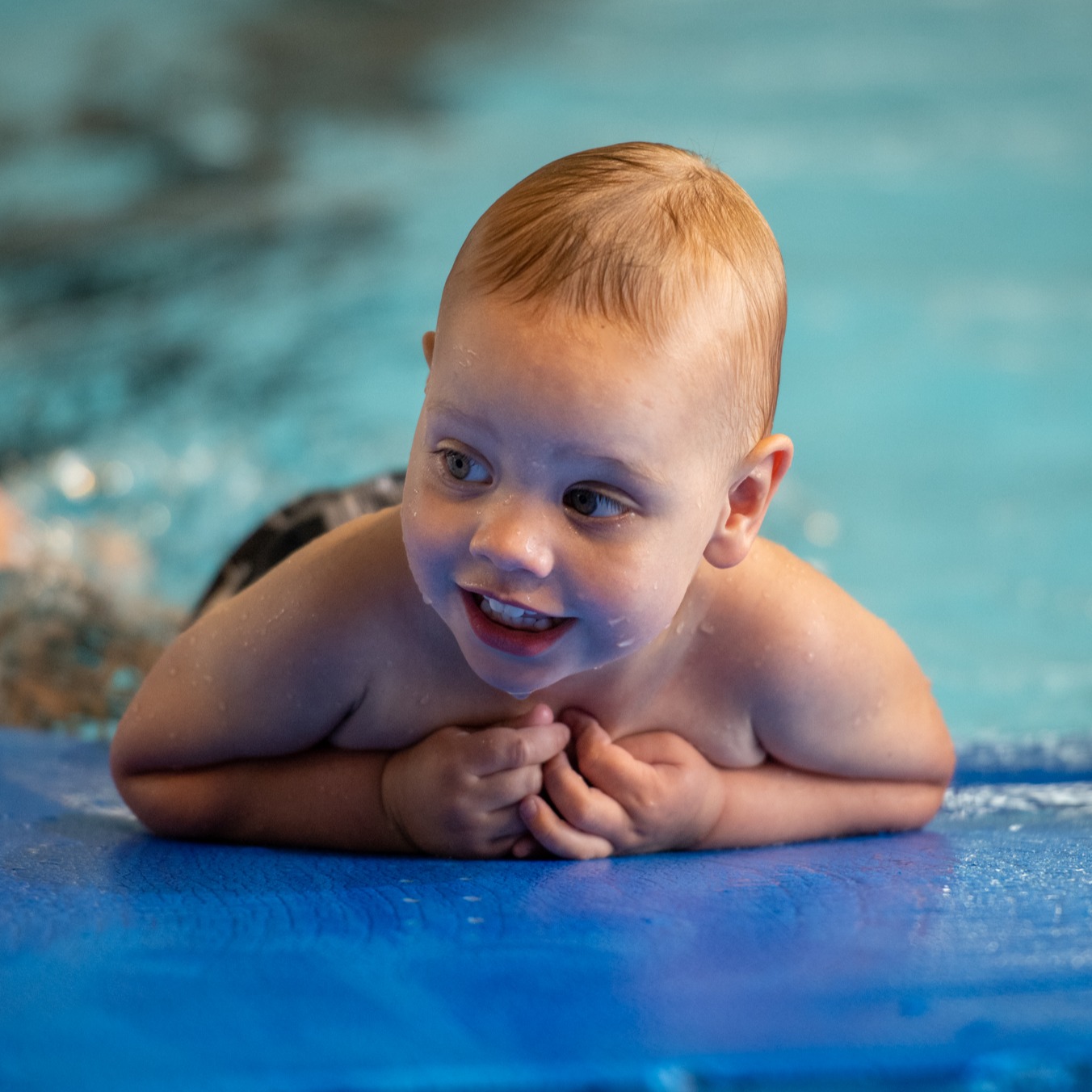Baby on float kicking